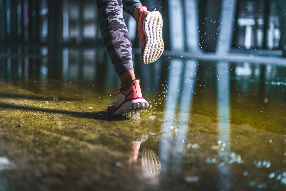 Woman running through water